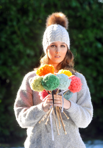 Kylie beanie topped with vegan pom pom. Knitted in Rowan Cocoon from The Knitter's Yarn