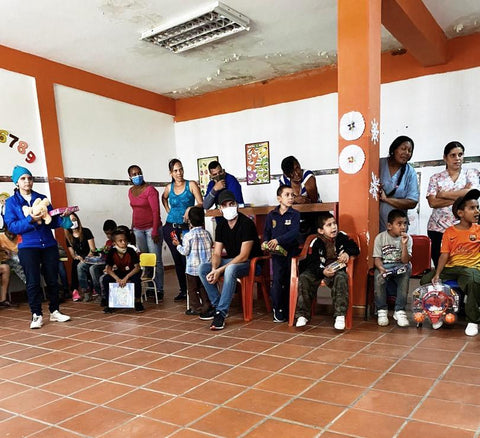 Group of children and Boahaus team celebrating the holidays