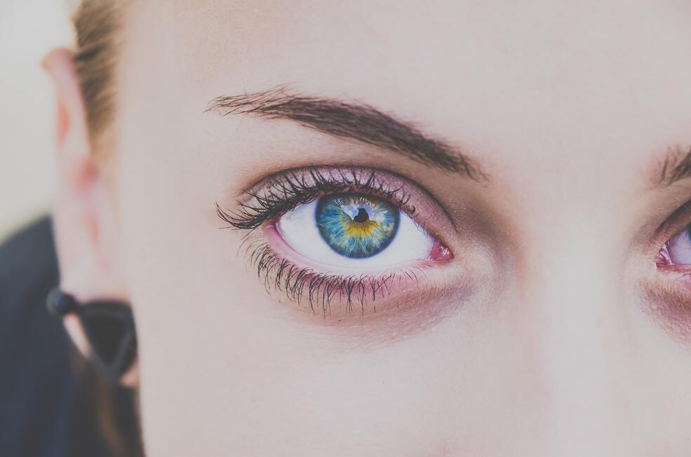 A close-up of a woman’s eye with subtle lash extensions