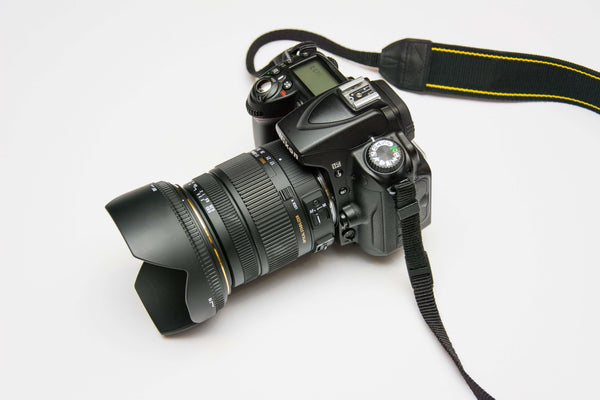 a professional camera against a white background