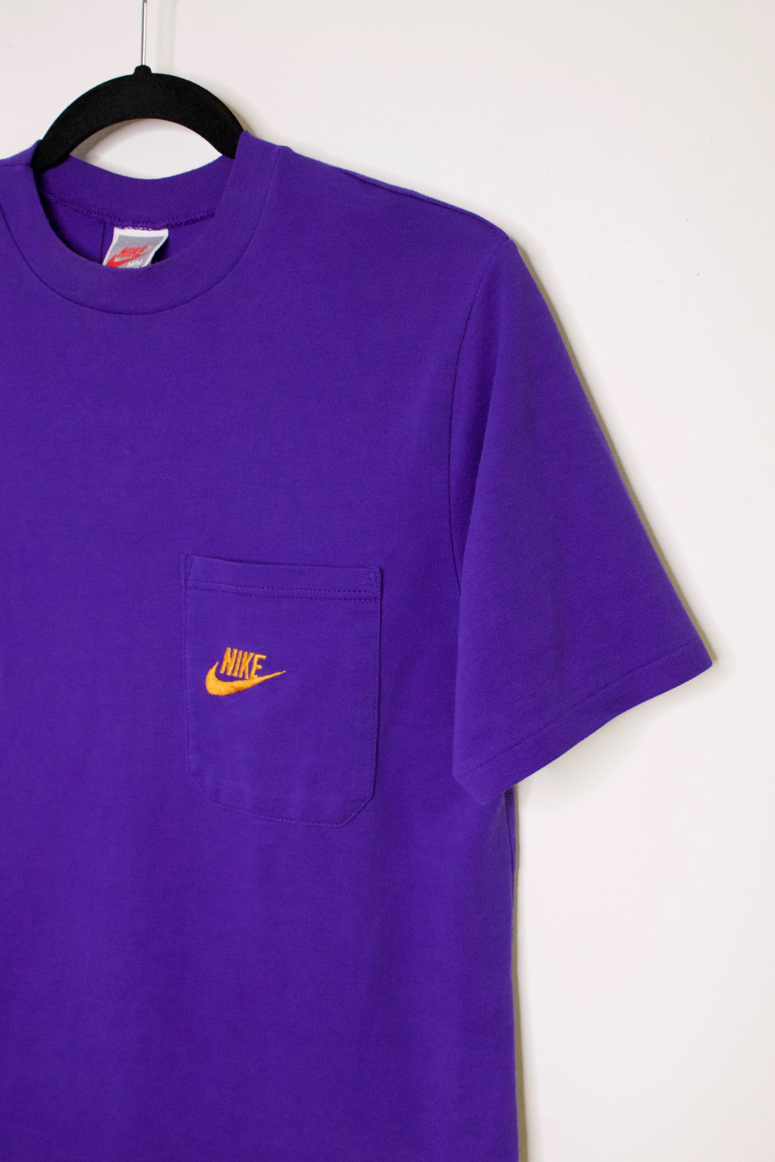 purple and black nike shirt