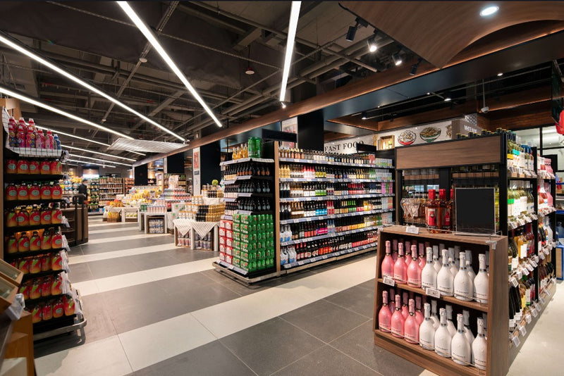 Supermarket linear lights illuminate general areas.
