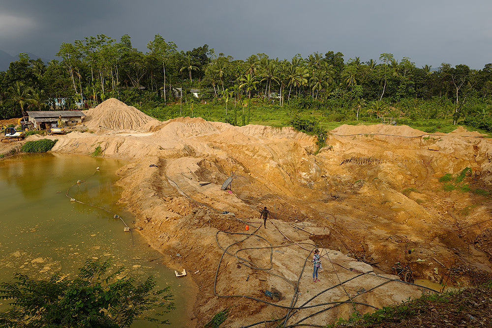 This is a typical scene showing larger-scale, mechanized gemstone mining in Ratnapura