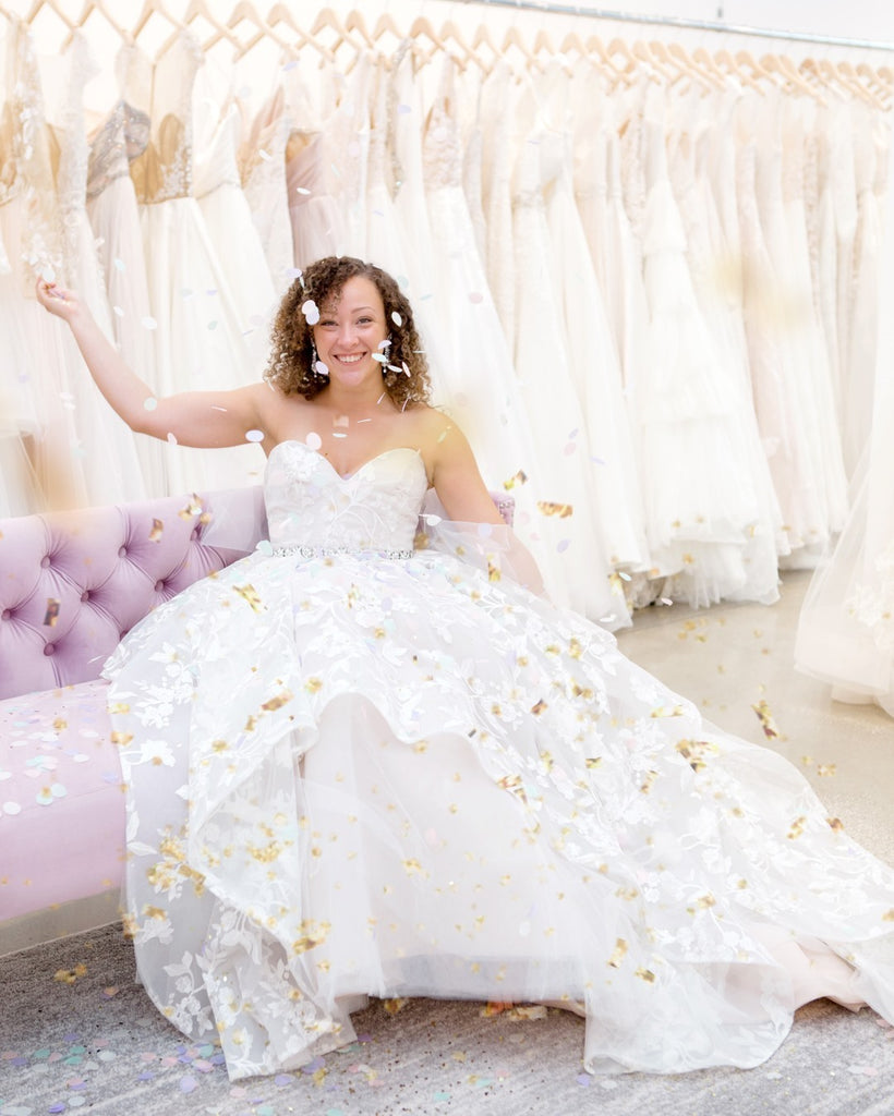 bride in wedding dress at wedding shop