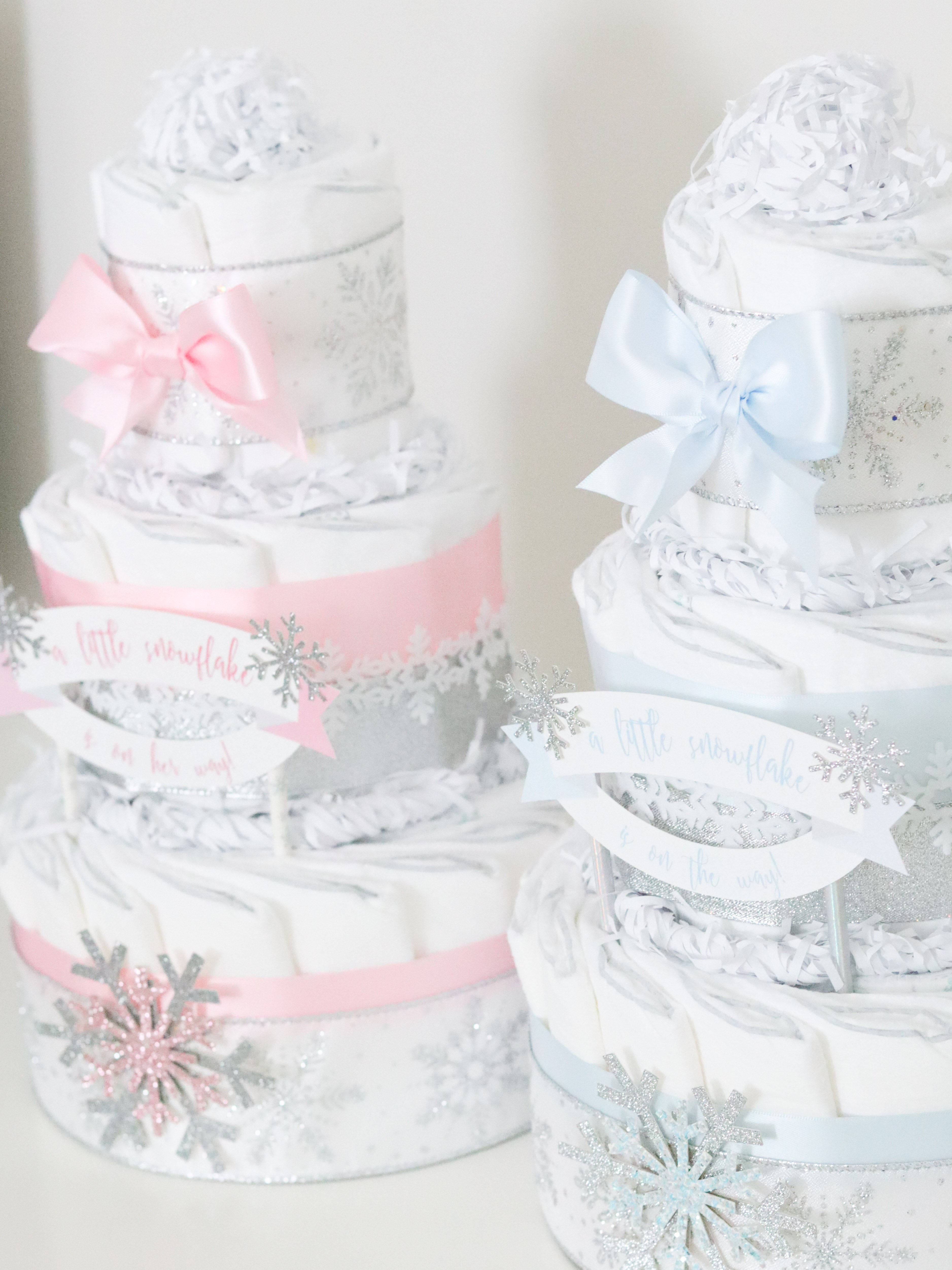baby it's cold outside diaper cakes in blue and pink