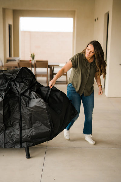 Susie from Hey Grill Hey installs a cover over a grill