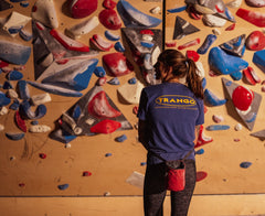 Alex Johnson faces a climbing training wall