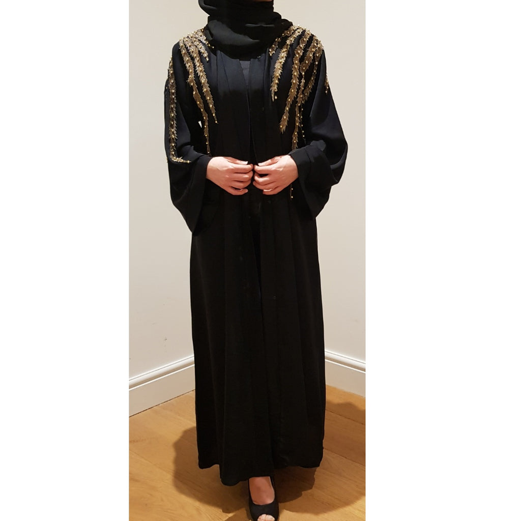 black and gold abaya
