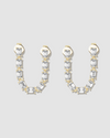 Diamond earrings on grey background