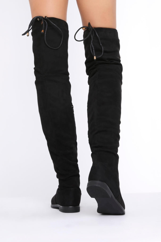 flat thigh high boot