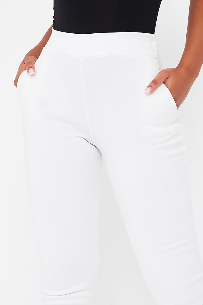 white slim joggers