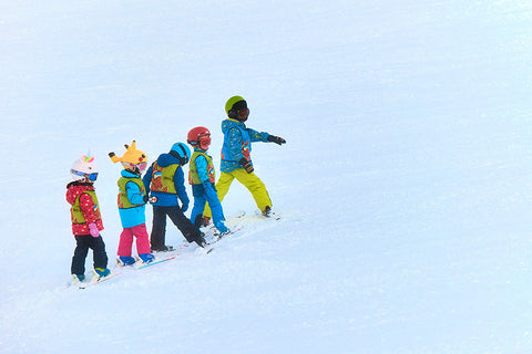 Group of Children learning to Ski - by Maxwell Ingham on Upsplash