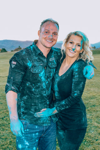 Couple with Blue Colored Powder All Over Them