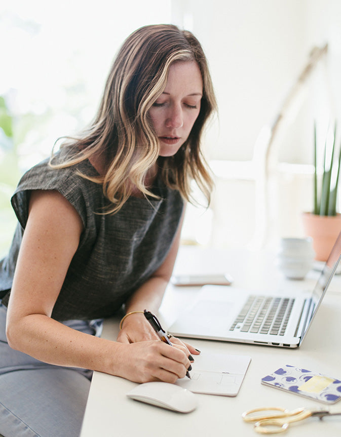 entrepreneur momprenuer working making a list