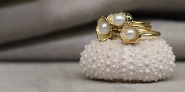 Sunken treasure stack rings in pearl and yellow gold