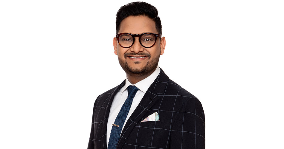 Professional business headshot with glasses