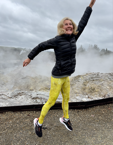 Sparkle Style Co. yellow sulfur crystal leggings at Hell's Gate geothermal park in Rotorua, New Zealand, known for its therapeutic sulfur spa and thermal activity including boiling mud pools, hot springs, and geysers.