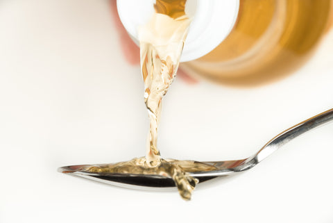 pouring rice vinegar onto a spoon