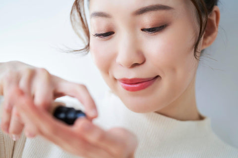 woman applying bb cream cc cream