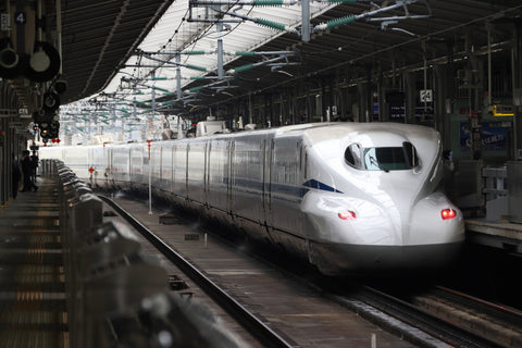 Shinkansen stopping at a station