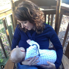 breastfeeding in a nursing top outside on a porch