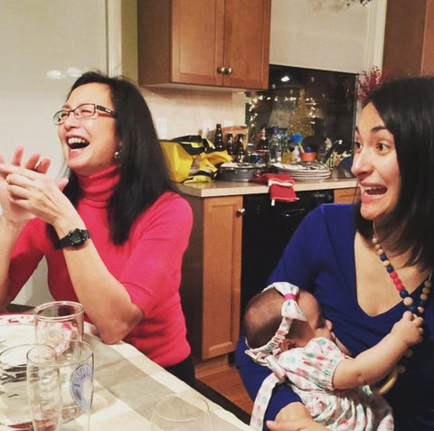 mother breastfeeding in a nursing dress