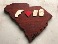 Picture of South Caroline shape wood with handshapes "H (heart) M E"