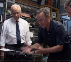 Tom Hanks using a typewriter