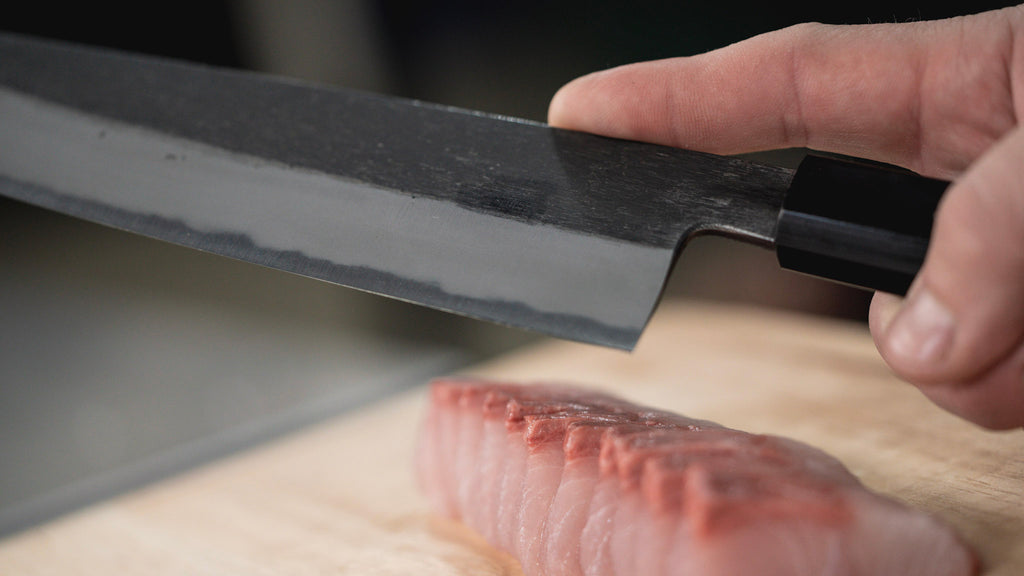 Japanese kitchen knife cutting fish