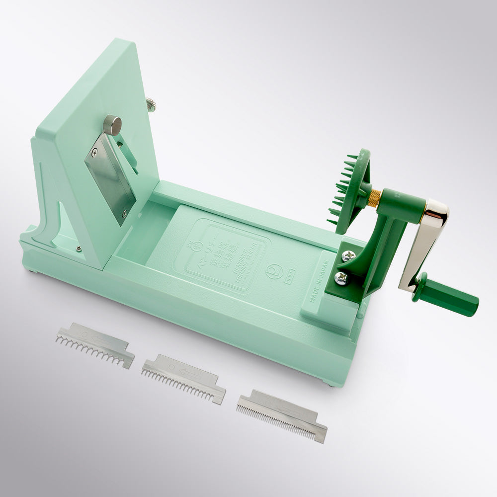https://cdn.shopify.com/s/files/1/1972/2573/products/benriner-turning-slicer-top-view-all-components.jpg?v=1668837827&width=1080