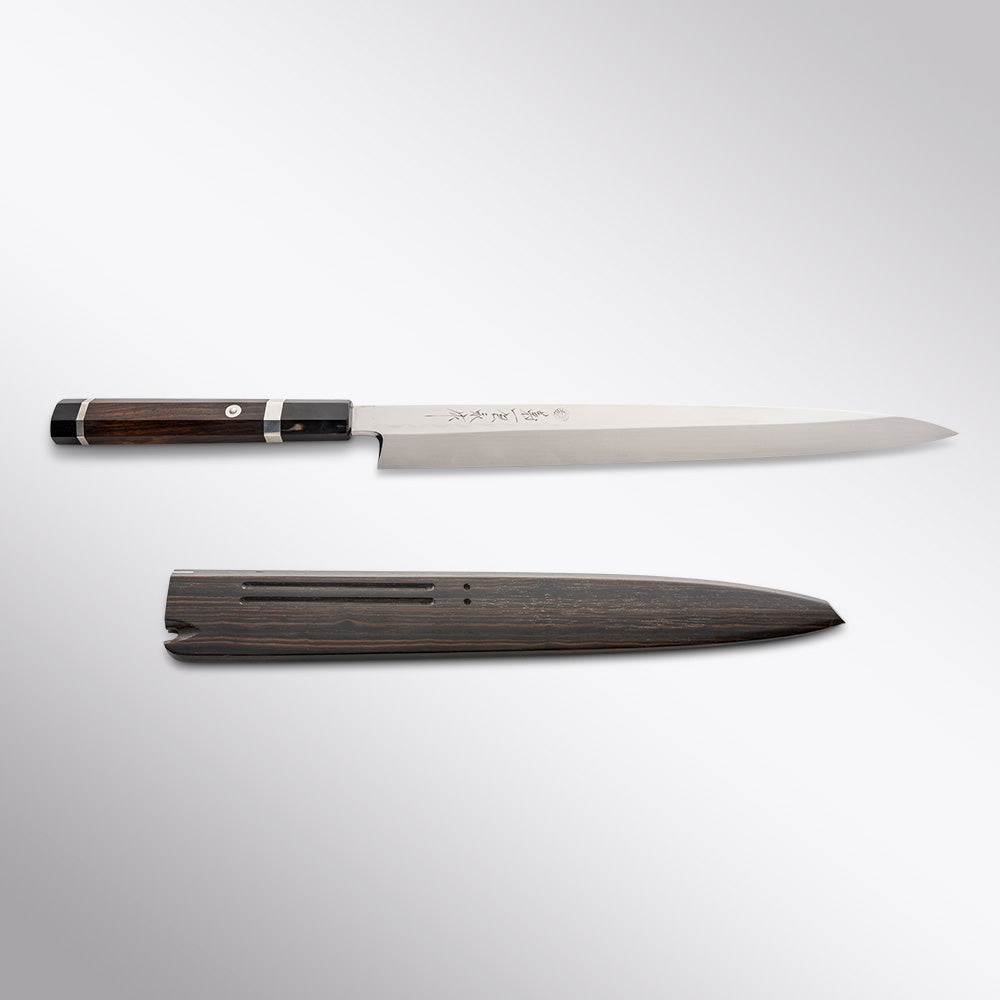 https://cdn.shopify.com/s/files/1/1972/2573/products/kikuichi-honyaki-aogami2-30cm-yanagi-ebony-rosewood-handle-front-with-saya.jpg?v=1664409201&width=1080