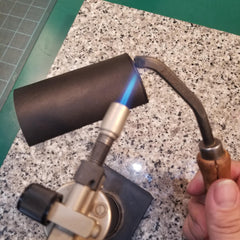 Heating up an edge tool with a torch