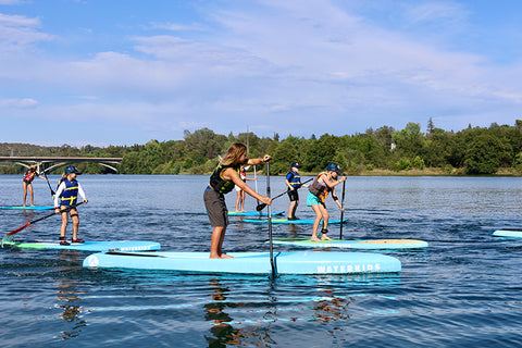 kids sup race camp youth learn how to paddle board