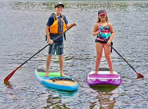 2 waterkids on their kids stand up paddle boards