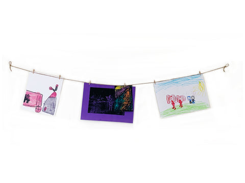 Hang children's artwork on a string with pegs 