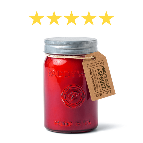 Red jar candle with five stars above it