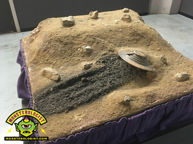 Roswell UFO Museum alien spaceship crash diorama scale model. 