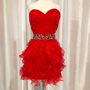 red dress with ruffles at the bottom