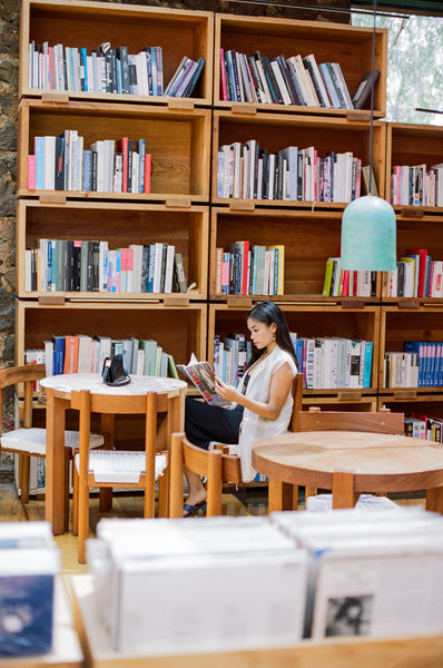 a girl with dark hair in a library