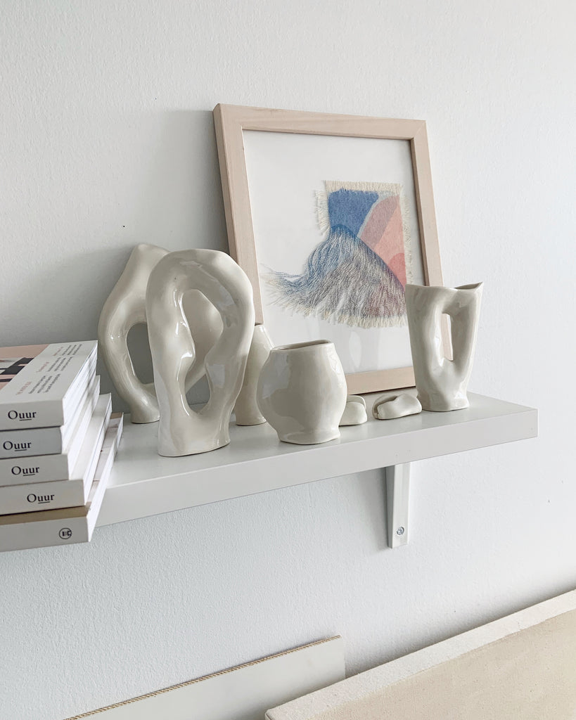 ceramic sculptures on a shelf 