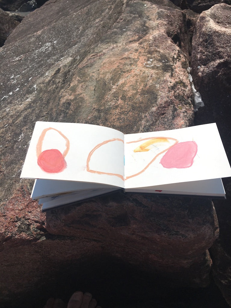 sketchbook on a rock