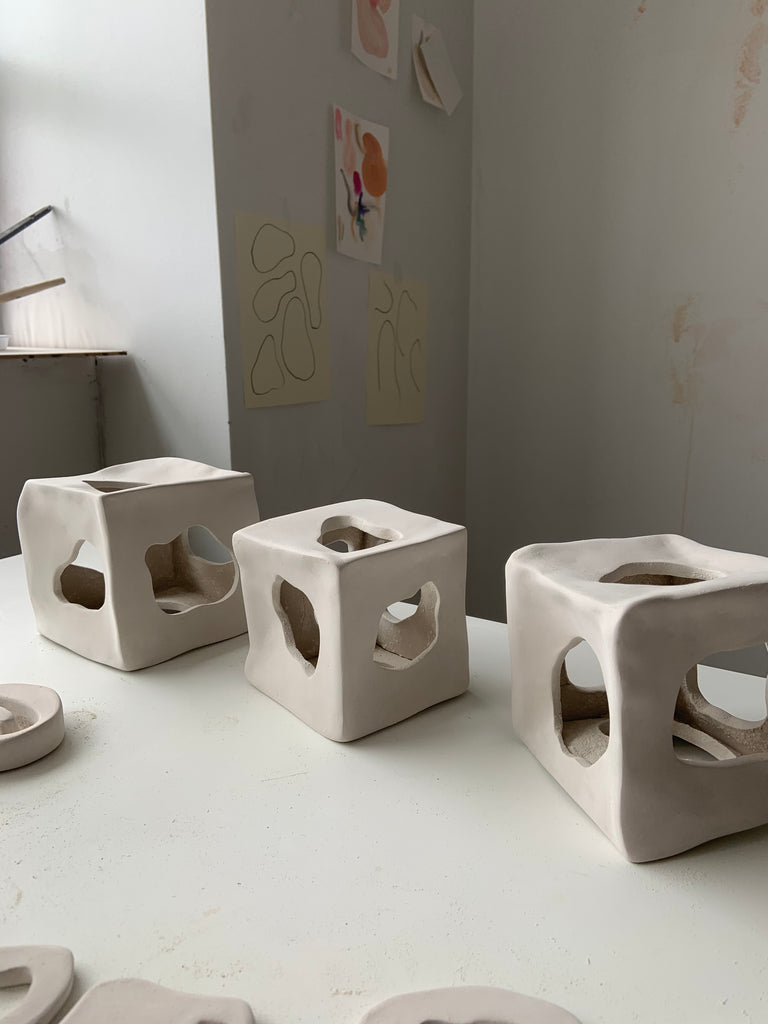 ceramic cubes with organic cut-outs 