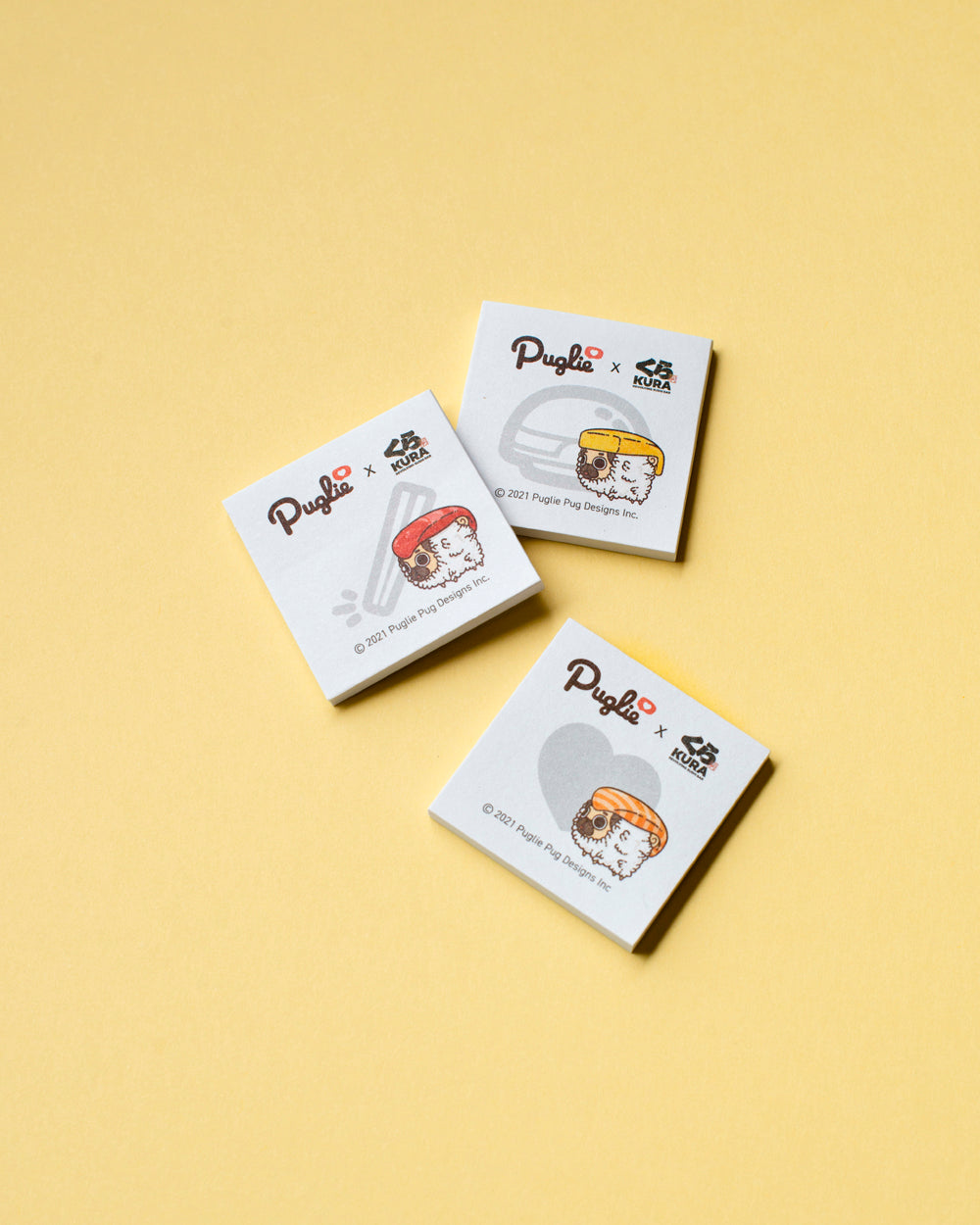 Photo of three Kura Sushi Puglie mini note pads.