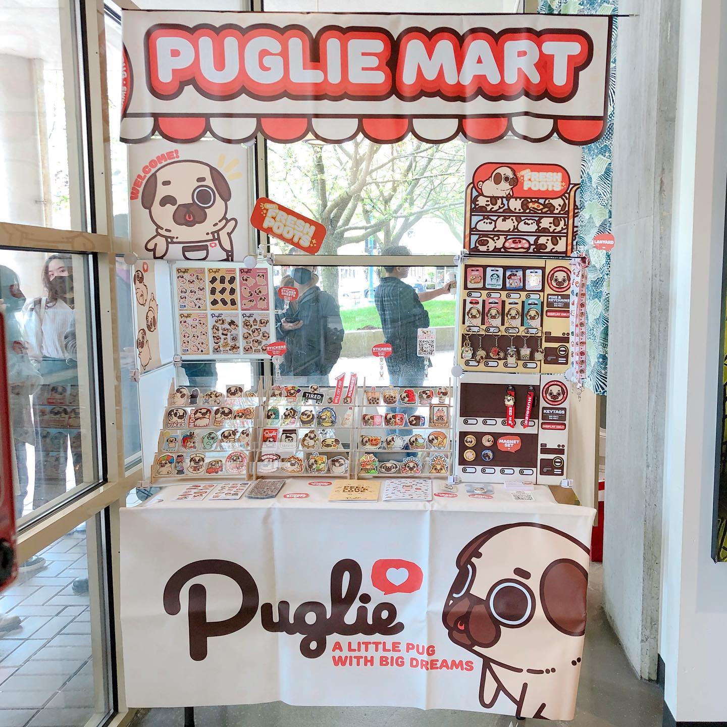 Photo of the Puglie Mart booth set up in the corner of Matcha Cafe Maiko.