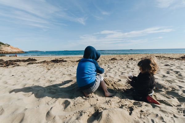 kids playing on a cool beach day