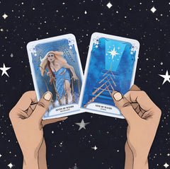 Two cards from the Crystal Magic Tarot deck (seven of wands and nine of wands) held up by hands against a background of stars in the night sky