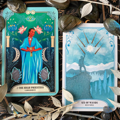 The Crystal Magic Tarot High Priestess and the Six of Wands with labradorite crystals and dried flowers