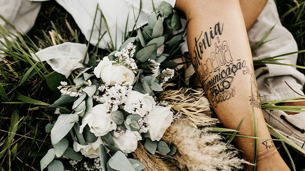Bride with leg tattoo with flowers