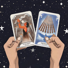 Five of swords and eight of wands cards from The Crystal Magic Tarot deck held up against a starry night sky.