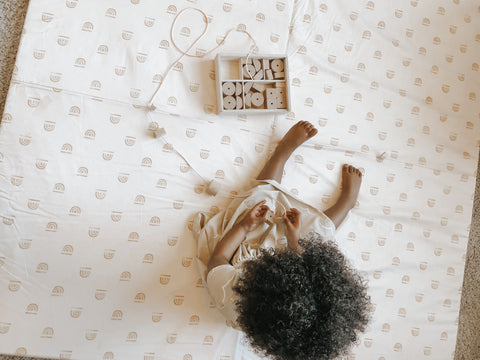 Child Playing on Mat